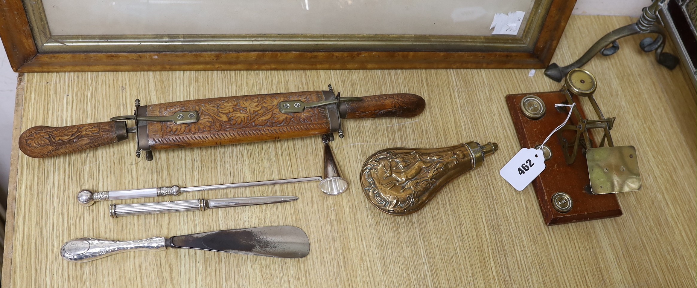 A Victorian embossed copper shot flask, postal scales and weights, plated items, a display knife and fork and a stained glass fireguard-55cms x 72cms high